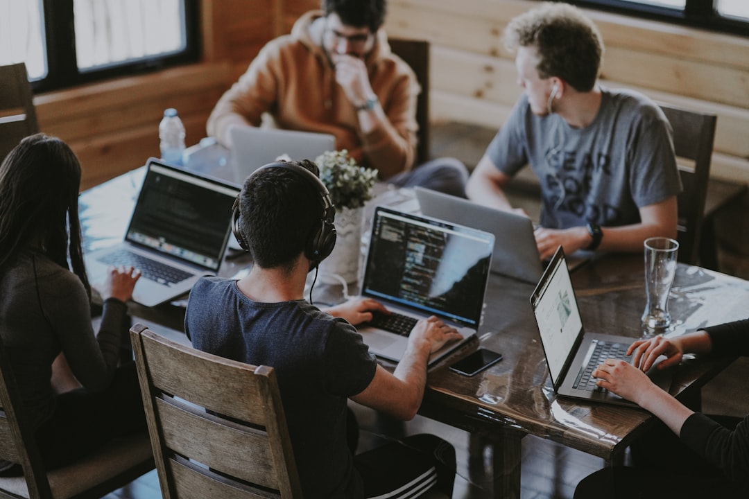 dental reviews ranking — group of people using laptop computer