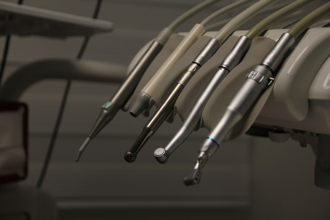 dental reviews ranking — a row of dental instruments hanging from a wall