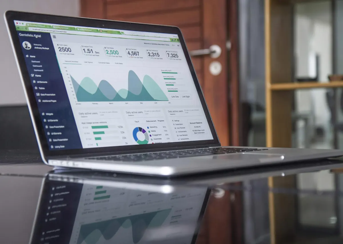 Laptop dashboard tracking local HVAC search visibility and service demand